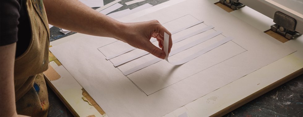 Rinsing the screen to reveal the stencil